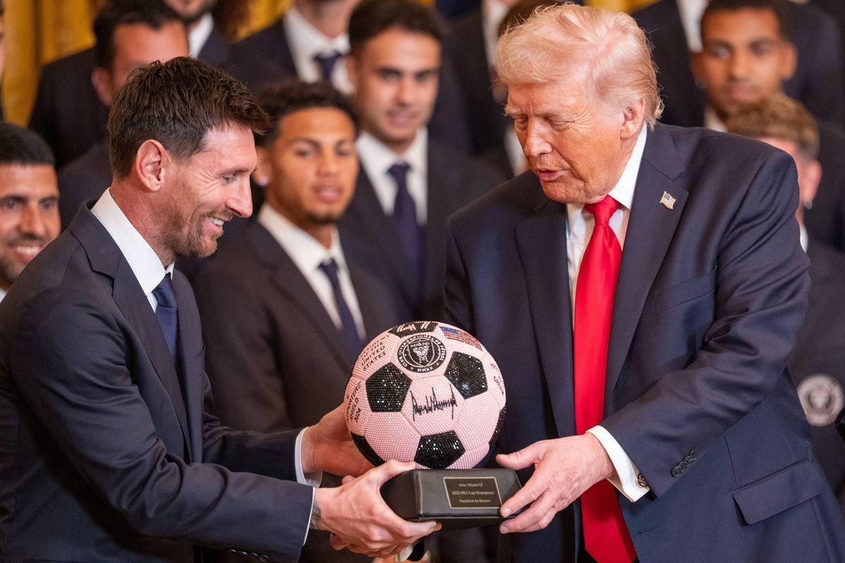 March 5, 2026, Washington, Dc, United States: Inter Miami forward Luuis Suarez looks on during a ceremony honoring the 2025 MLS Cup champion Inter Miami CF in the East Room of the White House in Washington, D.C., March 5, 2026. 05 Mar 2026 Pictured: March 5, 2026, Washington, Dc, United States: Inter Miami forward Lionel Messi presents a soccer ball to President Donald Trump during a ceremony honoring the 2025 MLS Cup champion Inter Miami CF in the East Room of the White House in Washington, D.C., March 5, 2026. Photo credit: ZUMAPRESS.com / MEGA TheMegaAgency.com sales@mega.global